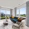 Virtually staged living room with couch, side chair, coffee table and TV console