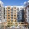 View of the interior courtyard of our apartments for rent in Somerville, featuring modern siding with balconies.